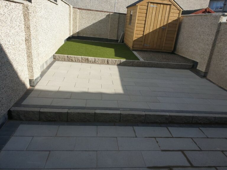Tiered Granite Patio with Astroturf and Gravel Patch in Dublin